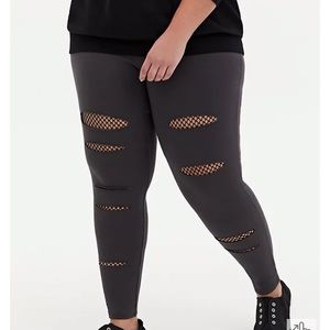 🖤Torrid leggings with rips and fishnet material. Size 3